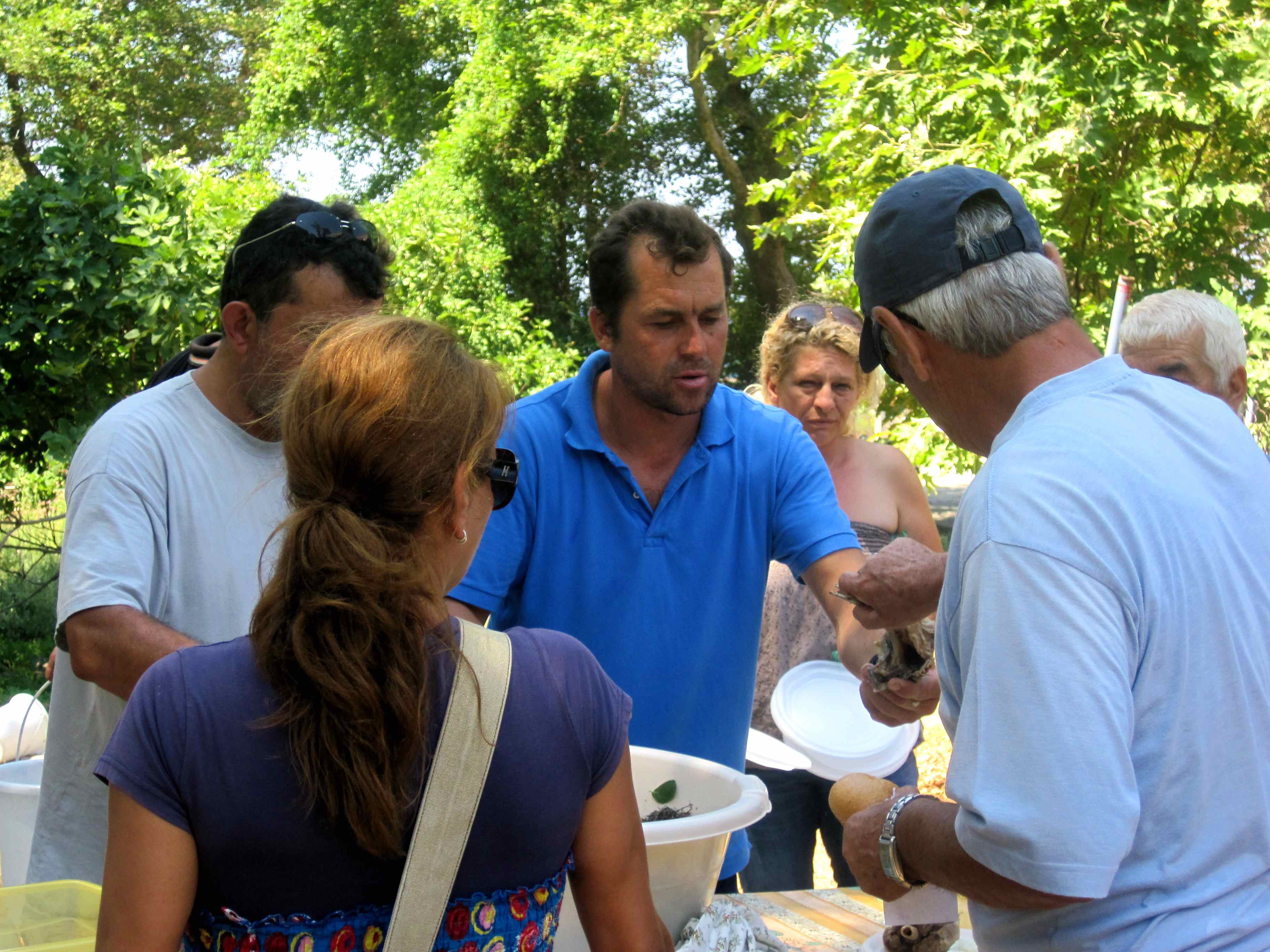 Serving freshly cooked goat to hungry Samothracians